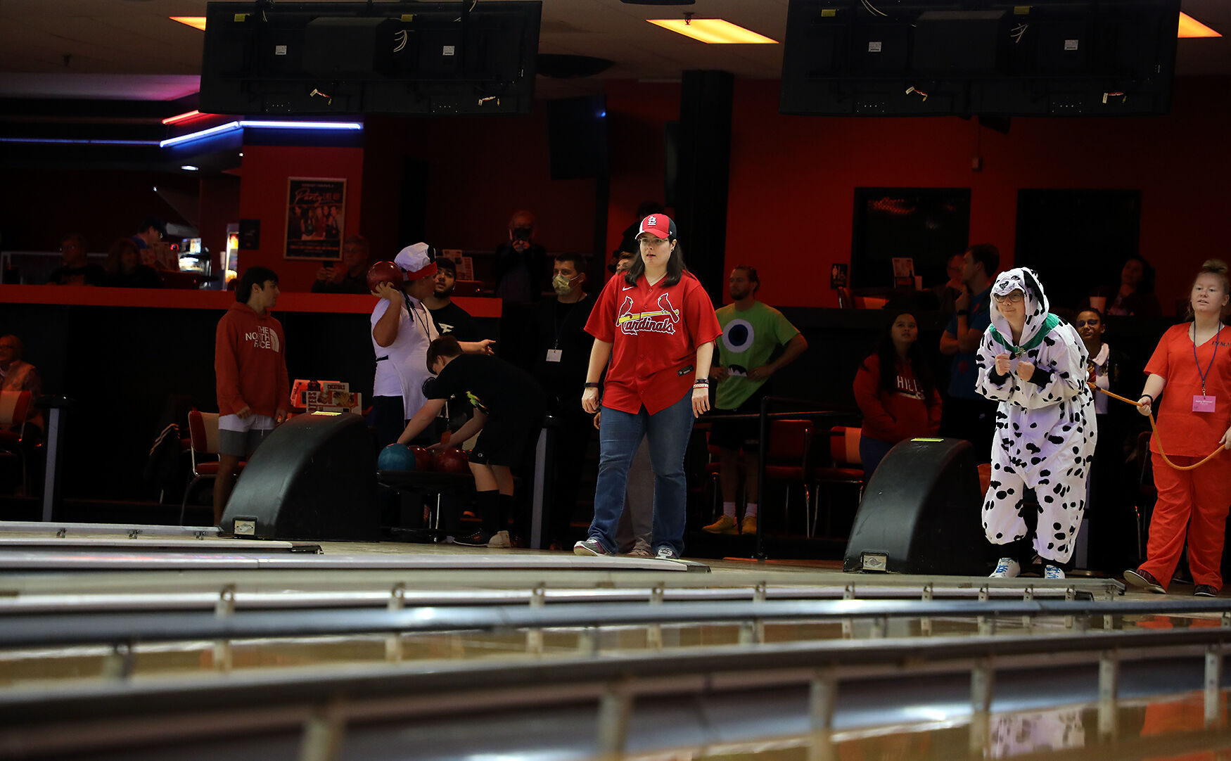 Tatia Leyden watches her bowl roll down the lane in the Halloween bowling match